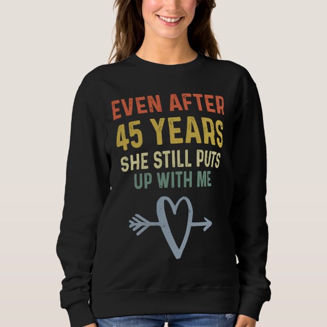 45th Anniversary  Couples She Still Puts Up With M Sweatshirt (Front)
