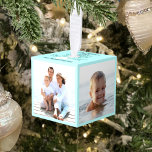 4 Photo Family Beach Christmas Aqua Blue Cube Ornament<br><div class="desc">Preserve your family memories of a special beach vacation with this light aqua blue 4 photo holiday photo cube ornament. On the top is a glitter coral piece, sand dollar, and starfish, with “Merry Christmas” and your family name. *If you would like this design on more products or need design...</div>