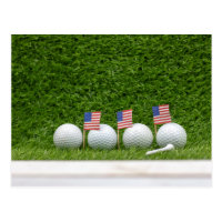 4th July golf ball with flag of America on green Postcard