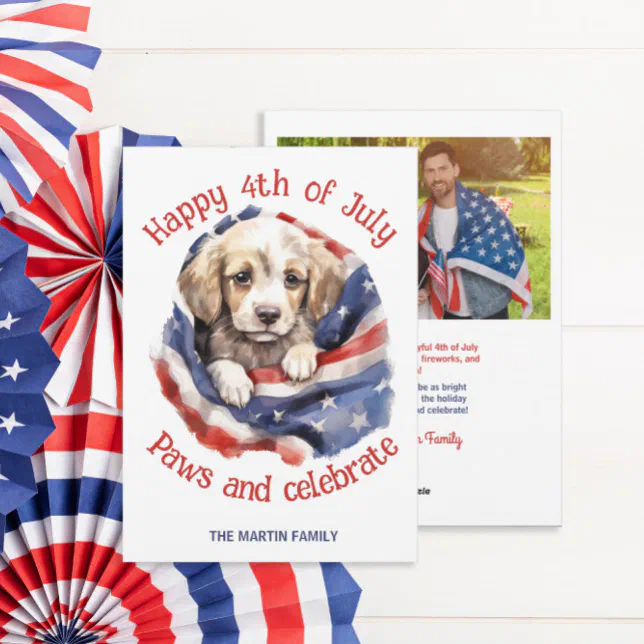A 4th of July card with a puppy on the front and space for a photo on the back. Red, white, and blue decorations can be seen to the left of the card.
