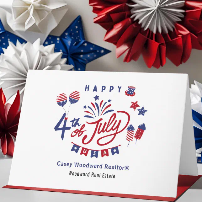 A happy 4th of July card from a realtor company. Red, white, and blue décor can be seen hanging in the background.