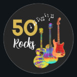 50 Rocks 50th birthday party Classic Round Sticker<br><div class="desc">50th birthday party 50 rocks stickers with three cool watercolor guitar designs on black background. An electric guitar with Fire flame pattern and red pick guard, a multicolored semi acoustic guitar and a psychedelic classic acoustic guitar art illustration black and gold modern cool typography. This easy to use template creates...</div>