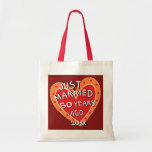 50th Anniversary or Any Yr Funny Romantic Gift Tote Bag<br><div class="desc">A one-of-a-kind, fun anniversary gift for family or friends. What a conversation starter when they're out and about shopping or toting their treasures around. Whimsy is the word for this red and orange decorated heart proclaiming "JUST MARRIED... ..50 YEARS AGO". See more wedding anniversary gifts at Zigglets here at Zazzle....</div>
