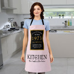 50th Birthday 1973 Name Elegant Black Gold Pink Apron<br><div class="desc">A wonderful birthday black and gold design on an apron for that special celebration. Easily customize the text using the template provided. Part of the setting standards range of birthday supplies.</div>