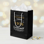 50th Birthday 1976 Add Name Legend Black Gold Medium Gift Bag<br><div class="desc">Celebrate a special milestone with this 50th birthday born 1976 Legendary Black Gold Medium Gift Bag. Printed with a classic design in black, and gold, this gift bag is perfect for holding presents, cards, and other special tokens for the big day. Add your loved one's name to the bag for...</div>