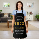 50th Birthday Born 1973 Black Gold Lady's Apron<br><div class="desc">A personalized classic black apron design for that birthday celebration. Add the name to this vintage retro style black, white and gold design for a custom birthday gift. Easily edit the name and year with the template provided. A wonderful custom birthday gift. More gifts and party supplies for that party...</div>