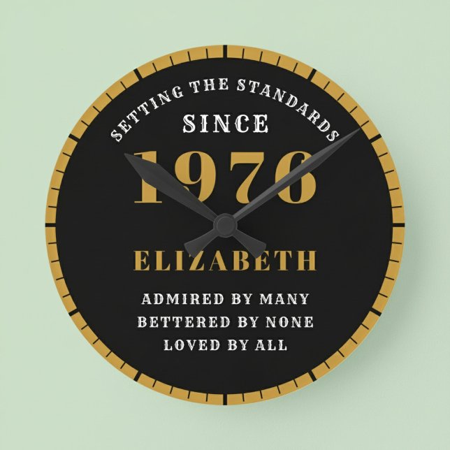 50th Birthday Born 1976 Black Gold Round Clock (Born 1976 standards birthday clock. Pastel background.)