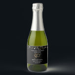 50th birthday gold black theme confetti thank you sparkling wine label<br><div class="desc">Pop the bubbly and thank your guests for coming. Use these labels for your mini sparkling wine giveaways at your 50th birthday party. An elegant black and printed gold design for your milestone birthday celebration. Personalize with your name and other greetings. Black gold print confetti dot design adds to the...</div>