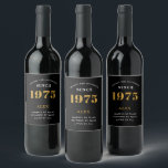 50th Birthday Name 1975 Black Gold Elegant Chic Wine Label<br><div class="desc">1975 Vintage 50th Birthday Black & Gold Elegant Wine Label. Celebrate your milestone with our exclusive birthday wine label. The meticulously designed label with stunning black and gold hues effortlessly enhances the visual appeal of your favorite wine. The year prominently featured on the label, adds a nostalgic throwback to the...</div>
