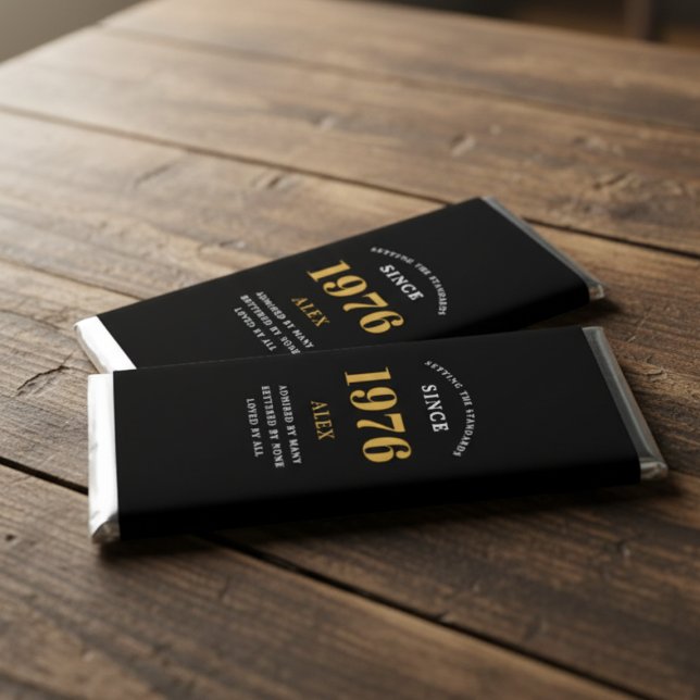 50th Birthday Name 1976 Black Gold Elegant Chic Hershey Bar Favors (Personalized chocolate bar wrappers on a wooden table.)