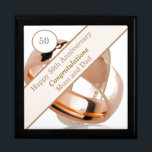 50th Wedding Anniversary  Gift Box<br><div class="desc">This lovely Anniversary gift box is perfect for a couples 50th Wedding Anniversary. The suggested theme for this anniversary is gold. With this in mind I have featured two gold wedding rings in the design with a banner and editable text so it can be made truly personal. Perfect to hold...</div>