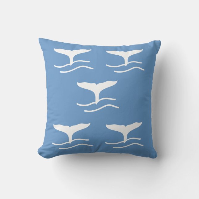 5 white whale tails on  blue pillow (Front)