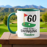 60 and Still Swinging, Funny 60th Birthday Golfer Mug<br><div class="desc">Celebrate turning 60 with a swing! This funny golf-themed mug features the phrase "60 and Still Swinging" — perfect for any golfer hitting the big 6-0. Add a name to make it extra special! A great birthday gift for golf lovers who enjoy a good laugh on and off the course....</div>