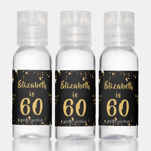 60th Birthday Modern Black Gold Stars Favor Gift Hand Sanitizer - Celebrate a 60 year old (or any age as the text is editable) and thank party guests with these personalized party favor gifts designed in an editable black background color and gold text color with gold stars. Include a personal messages on the left and/or right sides. The sample text says THANK YOU FOR CELEBRATING WITH US and duplicated on both sides but they can be different. CHANGES:  Change the colors or font style by clicking on CUSTOMIZE FURTHER. Contact the designer via Zazzle Chat or makeitaboutyoustore@gmail.com if you'd like this design modified, on another product or want coordinating items.