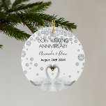 60th diamond wedding anniversary white swans ceramic ornament<br><div class="desc">Two beautiful swans in love bending their heads toghether and forming a heart. Decorated with faux diamonds. White elegant background, perfector for a diamond wedding anniversary! A swan couple stay together for life, so they are the perfect symbol of love. With the text: 60th Anniversary. Template for two names, black...</div>