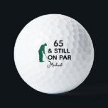 65th Birthday Funny Custom Golf Ball with Name<br><div class="desc">Celebrate a milestone in style with this funny and personalized golf ball design. Featuring the phrase “65 & Still On Par” with a golfer silhouette, it’s the perfect way to honor an avid golfer turning 65. Add a custom name for a personal touch and create a memorable keepsake that combines...</div>