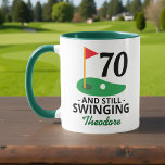 70 and Still Swinging, Funny 70th Birthday Golfer Mug<br><div class="desc">Celebrate turning 70 with a swing! This funny golf-themed mug features the phrase "70 and Still Swinging" — perfect for any golfer hitting the big 7-0. Add a name to make it extra special! A great birthday gift for golf lovers who enjoy a good laugh on and off the course....</div>