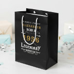 70th Birthday 1956 Add Name Legend Black Gold Medium Gift Bag<br><div class="desc">Celebrate a special milestone with this 70th birthday born 1956 Legendary Black Gold Medium Gift Bag. Printed with a classic design in black, and gold, this gift bag is perfect for holding presents, cards, and other special tokens for the big day. Add your loved one's name to the bag for...</div>