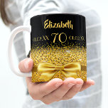 70th birthday black gold elegant name classic coffee mug<br><div class="desc">Elegant, classic, glamorous and feminine. A gold colored ribbon and bow with golden glitter and sparkle, a bit of bling and everyday luxury. Black background. The Perfect gift for a 70th birthday! Templates for a name, age 70 and date of birth and the anniversary date. Golden letters. The name is...</div>