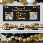 70th Birthday Black Gold String Lights Photos Banner<br><div class="desc">Celebrate a 70th birthday with this black and gold party banner sign with string lights featuring a retro typography title design of 70 YEARS IN THE MAKING that incorporates their birth year as part of the design, 2 photos (fun to include Then and Now photos) and your personalized custom message...</div>