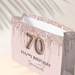 70th birthday blush pink glitter drips rose gold large gift bag<br><div class="desc">Elegant, classic, glamorous and girly for a 70th birthday party. A blush pink background. Decorated with rose gold, pink faux glitter drips, paint dripping look. Personalize and add a name. With the text: Happy Birthday. The name is written with a modern dark rose colored hand lettered style script. Number 70...</div>