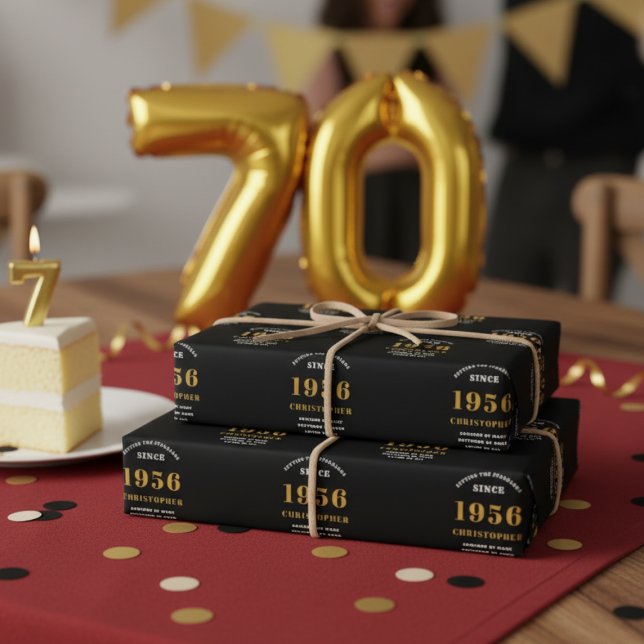 70th Birthday born 1956 Add Name Black Gold Wrapping Paper Sheets (70th birthday wrapping paper on a table.)