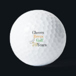 70th Birthday Golf Cheers and Beers Golf Balls<br><div class="desc">This is a cool and modern, 70th birthday, golf design. It is a simple, minimal design, in classic black and white, with pops of gold, orange and green typography. Perfect for a cool and fun, golf and beer themed, 70th birthday gift or party accessory and ideal as birthday keepsakes or...</div>