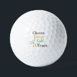 70th Birthday Golf Cheers and Beers Golf Balls<br><div class="desc">This is a cool and modern, 70th birthday, golf design. It is a simple, minimal design, in classic black and white, with pops of gold, orange and green typography. Perfect for a cool and fun, golf and beer themed, 70th birthday gift or party accessory and ideal as birthday keepsakes or...</div>