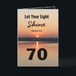 70th Birthday Let Your Light Shine Scriptural Text Card<br><div class="desc">Celebrate the joy of a 70th birthday with a the bible quote card "Let Your Light Shine" (Matthew 5:16). The scriptural text has a bold 70 design showing a black and gold sunrise on a peaceful lake. The blessing sends a message of faith and love. Open the card to read...</div>