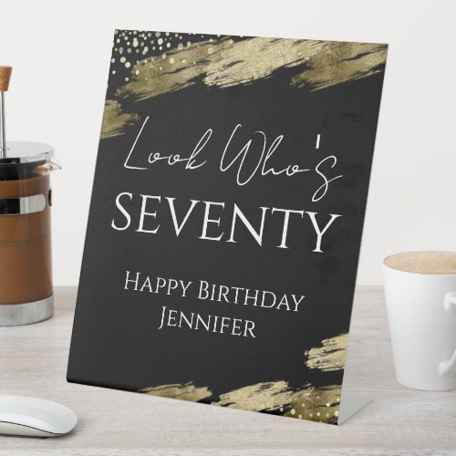 70th Birthday Look Who Gold Black Pedestal Sign