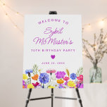 70th Birthday Purple Wildflowers Welcome Sign<br><div class="desc">Elegant spring watercolor wildflowers create a beautiful and feminine floral border that is accented with small heart. A trendy font combination gives it a modern aesthetic. All of the text is editable.</div>
