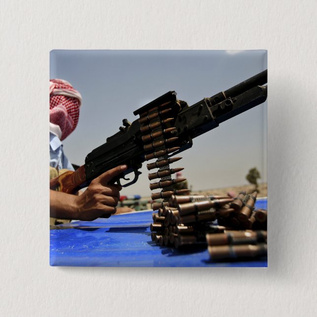 762 mm rounds lie on the truck pinback button (Front)