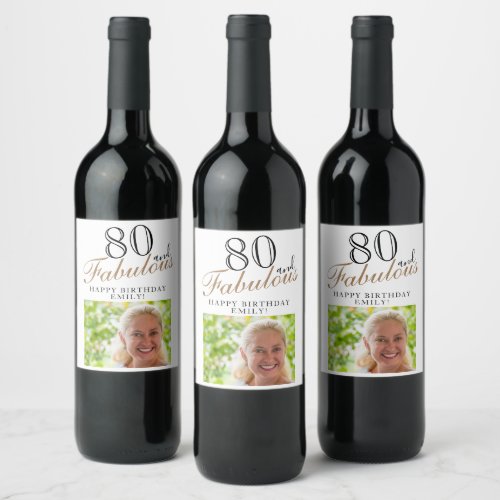 80 and Fabulous Elegant Script Photo 80th Birthday Wine Label - 80 and Fabulous Elegant Script Photo 80th Birthday Wine Label. The saying 80 and fabulous is in modern script on a white background. Make your own 80th birthday party wine labels for her. Customize with the name and age number and insert your photo into the template.