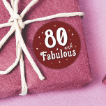 80 and Fabulous Glitter Red 80th Birthday Classic Round Sticker<br><div class="desc">80 and Fabulous Glitter Red 80th Birthday Sticker. 80 and fabulous text in trendy white script with a name on a dark red background. Personalize it with your the age.</div>