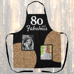 80 and Fabulous Gold Glitter 2 Photo 80th Birthday Apron<br><div class="desc">80 and Fabulous Gold Glitter 2 Photo 80th Birthday Apron. Faux gold glitter on black with 2 photos - you can use old and new photos. Add your age,  and make a personalized birthday gift for a woman's milestone celebration.</div>