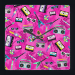 80s retro square wall clock<br><div class="desc">A colorful and retro 80's clock,  it is like stepping into a time machine and traveling to this cool era.  This clock features a lively pink design full of cassette tapes,  colorful instruments,  games and accessories from the 80's.  Purchase yours today!</div>