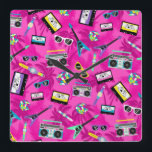 80s retro square wall clock<br><div class="desc">A colorful and retro 80's clock, it is like stepping into a time machine and traveling to this cool era. This clock features a lively pink design full of cassette tapes, colorful instruments, games and accessories from the 80's. Purchase yours today!</div>