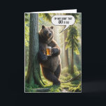 80th Birthday Bear With Beer Mug Card<br><div class="desc">A bear stands leisurely against a tree holding a mug of beer with one paw in a sunlit summer forest with a humorous speech bubble for an 80th birthday.
All text can be changed and the age.</div>