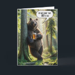 80th Birthday Bear With Beer Mug Card<br><div class="desc">A bear stands leisurely against a tree holding a mug of beer with one paw in a sunlit summer forest with a humorous speech bubble for an 80th birthday.
All text can be changed and the age.</div>