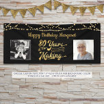 80th Birthday Black Gold String Lights Photos Banner<br><div class="desc">Celebrate an 80th birthday with this banner sign featuring a retro gold typography title design of 80 YEARS IN THE MAKING that incorporates his or her birth year as part of the design, 2 photos (fun to include Then and Now photos), gold string lights and your personalized custom message (the...</div>