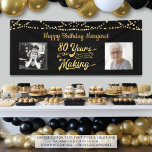 80th Birthday Black Gold String Lights Photos Banner<br><div class="desc">Celebrate an 80th birthday with this banner sign featuring a retro gold typography title design of 80 YEARS IN THE MAKING that incorporates his or her birth year as part of the design, 2 photos (fun to include Then and Now photos), gold string lights and your personalized custom message (the...</div>