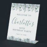 80th Birthday Dusty Blue Floral Welcome Pedestal Sign<br><div class="desc">Welcome your guests with this elegant tabletop pedestal sign. Pretty dusty blue roses,  peonies and wildflowers decorate the top and border. A classic and easy-to-read font combination takes only minutes to personalize.</div>