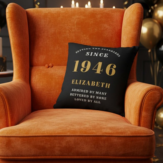 80th Birthday Gift Personalized 1946 Black Gold Throw Pillow (A vibrant orange velvet wingback armchair with a black throw pillow for an 80th birthday celebration)
