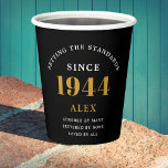 80th Birthday Name 1944 Black Gold Elegant Chic Paper Cups<br><div class="desc">Sophisticated 80th Birthday Unique Black & Gold Party Paper Cups. Celebrating a milestone birthday should be a memorable experience, and what better way to ensure that than with our sophisticated black and gold 80th Birthday Party Paper Cups? Designed in sleek black with an elegant gold highlight, these cups are printed...</div>