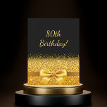 80th birthday party black gold bow sparkle invitation<br><div class="desc">Elegant,  classic,  glamorous and feminine style party invitation.  A gold colored ribbon and bow with golden glitter and sparkle,  a bit of bling and luxury for a birthday.  Black background. With the text: 80th Birthday! on front

Add your event details on back.</div>