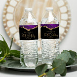 80th Birthday Party Purple Gold Agate Water Bottle Label<br><div class="desc">These chic 80th birthday water bottle labels feature a watercolor image of an agate geode in shades of purple with faux gold glitter highlights. The words "80th Birthday" appear in faux gold glitter in a decorative modern handwriting font. Customize it with the name of the guest of honor and the...</div>