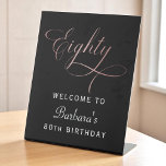 80th Birthday Party Rose Gold Script Welcome Pedestal Sign<br><div class="desc">Greet guests with elegance using this 80th Birthday Party Rose Gold Script Welcome Pedestal Sign. Designed with chic faux rose gold script and modern minimalist layout, this personalized sign is the perfect accent for entry tables, dessert stations, or gift areas. The sleek pedestal style makes it easy to display on...</div>