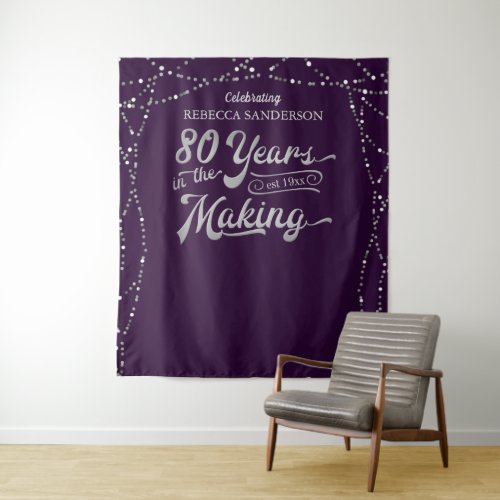 80th Birthday Photo Backdrop Purple Silver - Celebrate an 80th birthday and/or utilize as a photo op backdrop for pictures with this purple and silver wall hanging or banner sign featuring retro typography for 80 YEARS IN THE MAKING which incorporates their birth year within the design and personalized with their name. CHANGES:  You can change the background color or choose a styled graphics background by clicking on the CUSTOMIZE FURTHER tab at the bottom of the PERSONALIZE section. Contact the designer via Zazzle Chat or makeitaboutyoustore@gmail.com if you'd like this design modified, on another product or would like coordinating items.