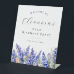 85th Birthday Party Blue July Birth Flower Welcome Pedestal Sign<br><div class="desc">Elegant summer watercolor blue larkspur flowers create a beautiful floral border at the bottom of this birthday party welcome sign,  larkspur or delphinium flowers are the July birth flower. A trendy font combination gives it a modern aesthetic. All of the text is editable.</div>