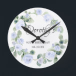90th Birthday Blue Rose Floral Eucalyptus Wreath Round Clock<br><div class="desc">A gift or keepsake for a 90th birthday. Blue roses are nestled in green eucalyptus leaves. The name is written in beautiful calligraphy with 100th birthday and date below.</div>